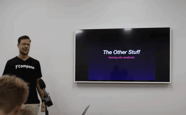 Philip standing beside a presentation titled 'The Other Stuff'